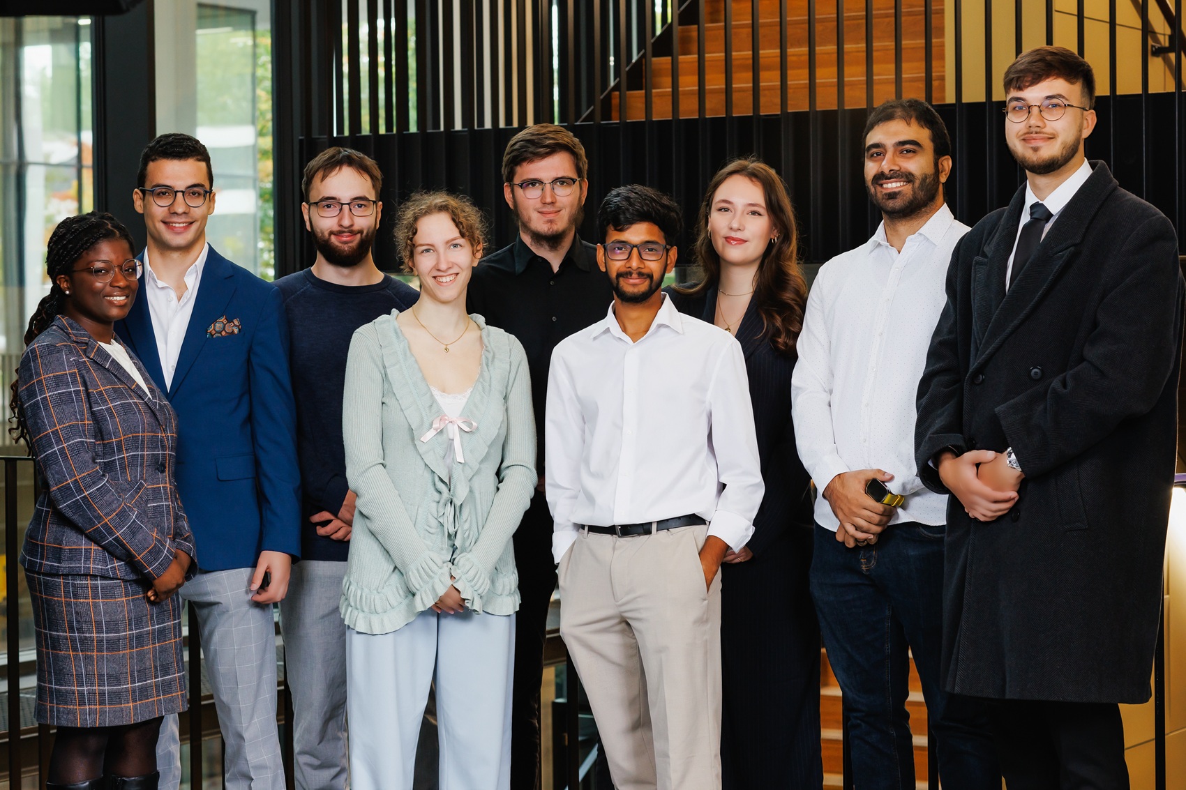 A group of 9 smilling students